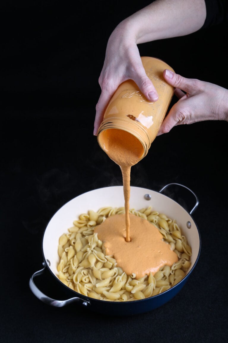 Roasted red pepper sauce poured over pasta.