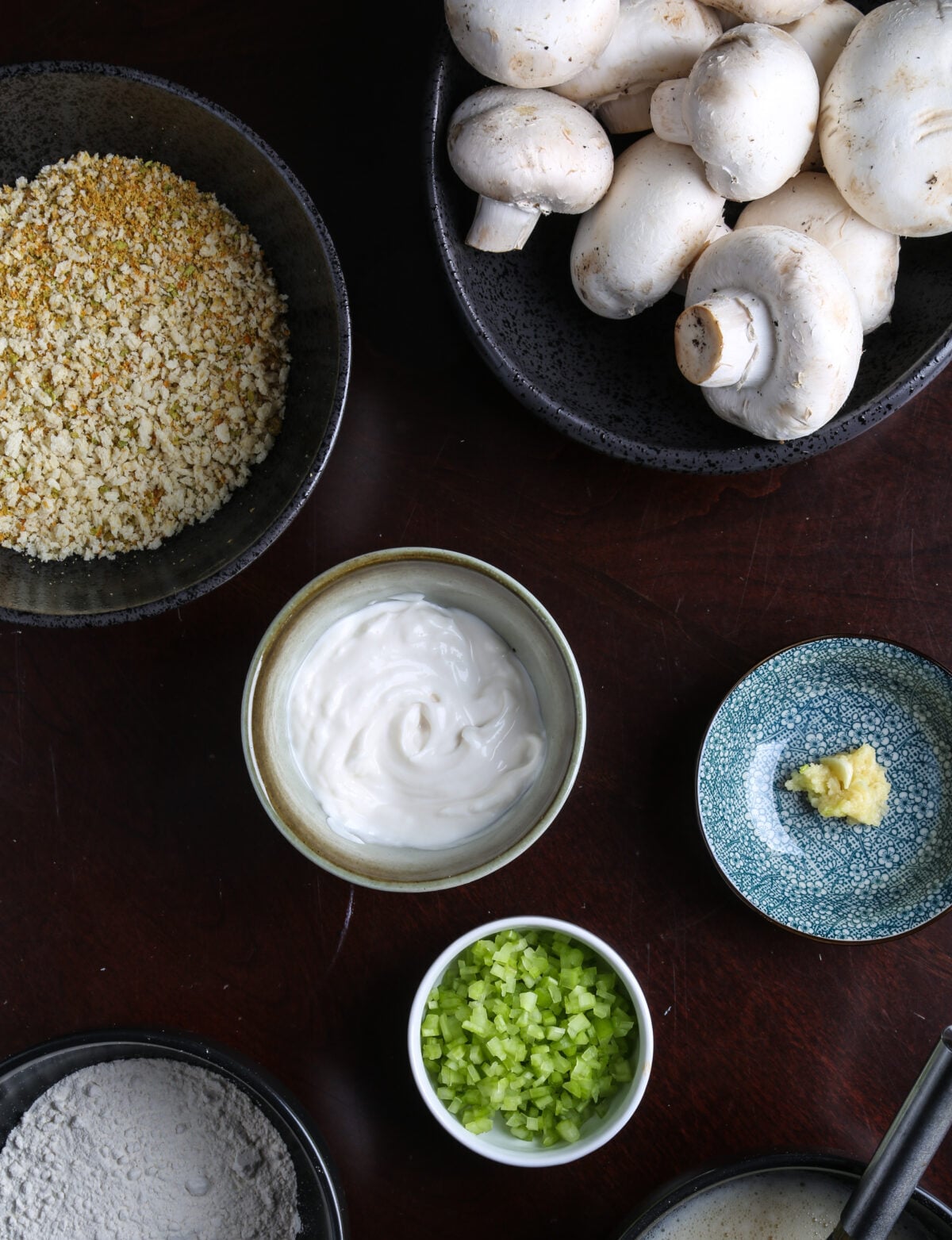 Key ingredients for air fried breaded mushrooms including panko, sriracha peas, and fresh mushrooms.