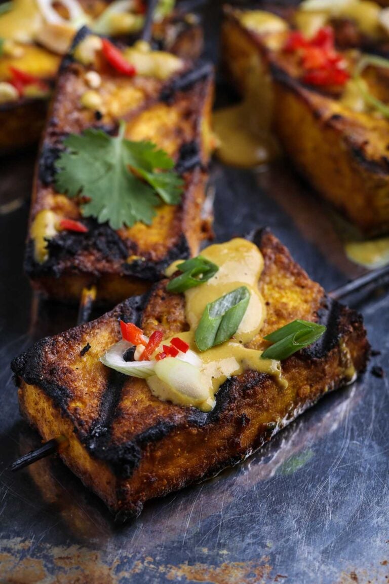 Tofu satay with garnish.