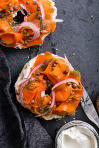 Vegan smoked salmon on a bagel with capers.