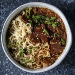Vegan French onion ramen with caramelized onions, seared seitan, and ramen noodles in rich umami broth.
