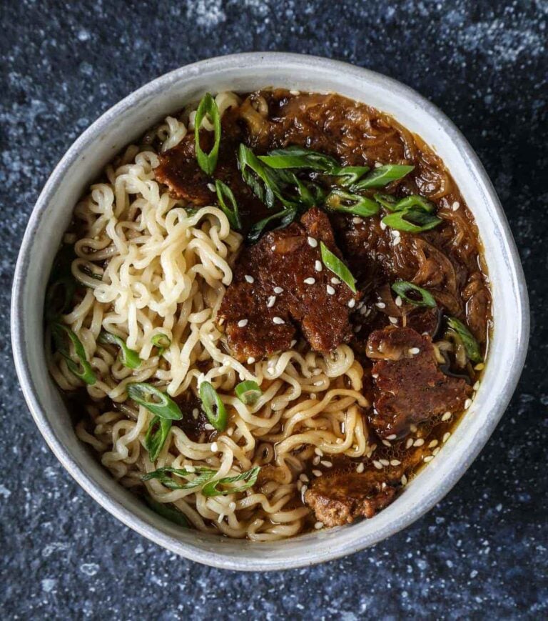 Vegan French onion ramen with caramelized onions, seared seitan, and ramen noodles in rich umami broth.