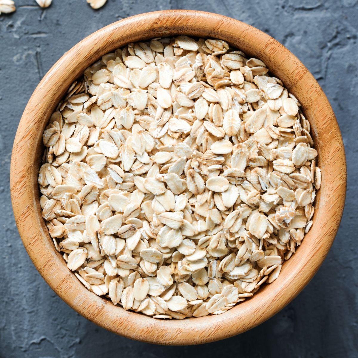Rolled oats in a wooden bowl.