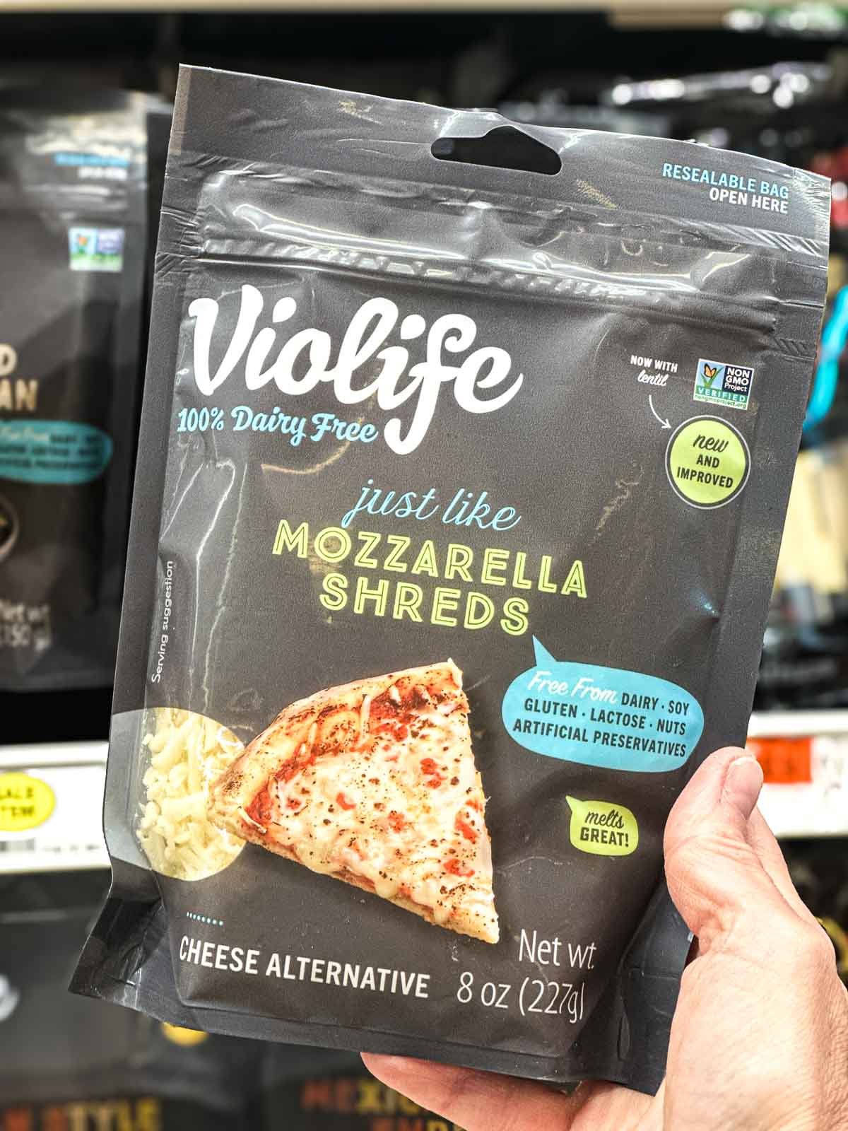 Violife mozzarella-style shreds in resealable packaging, labeled dairy-free and meltable.