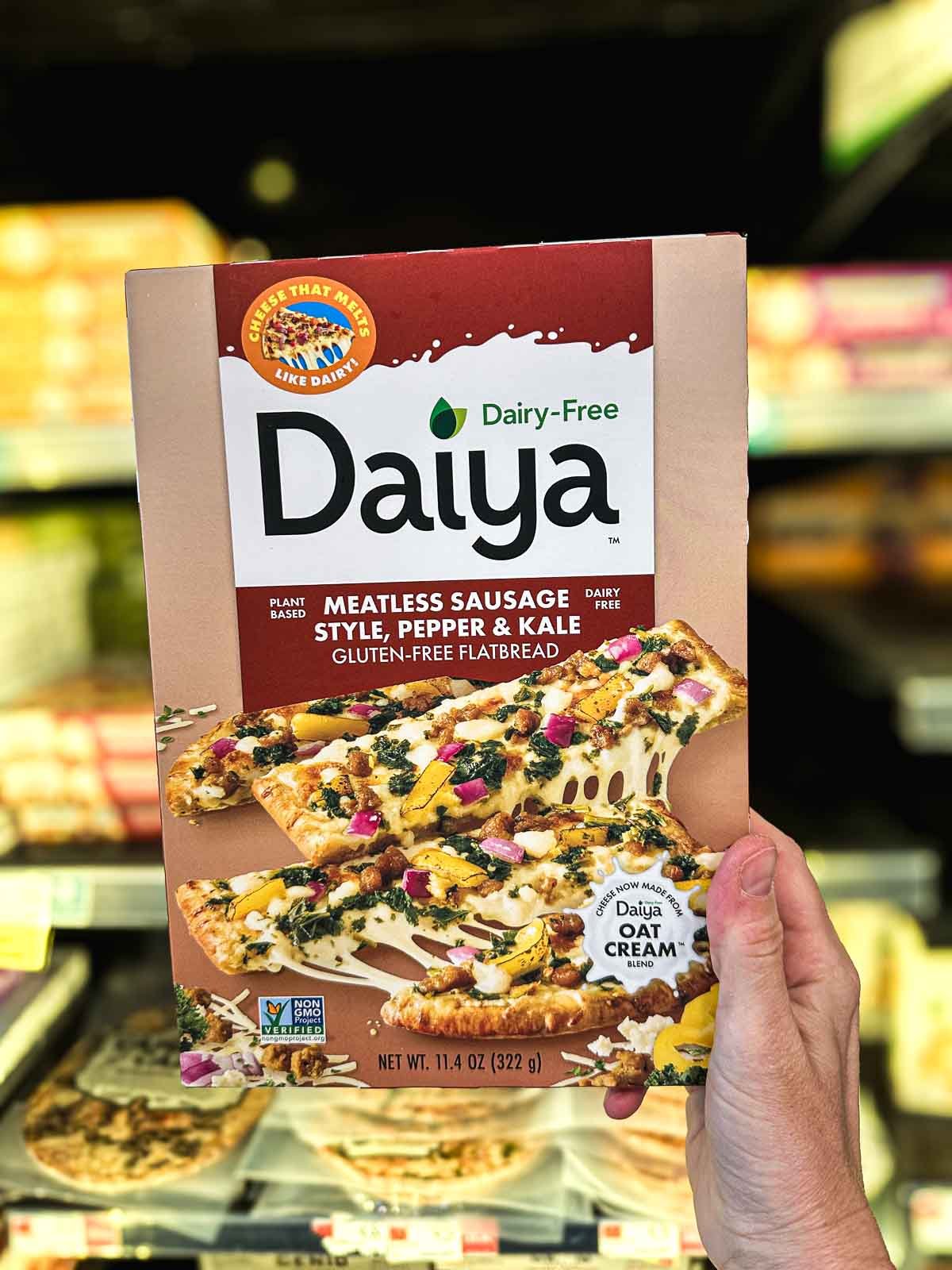 Daiya Meatless Sausage vegan flatbread with roasted peppers, kale, and creamy oat cheese.