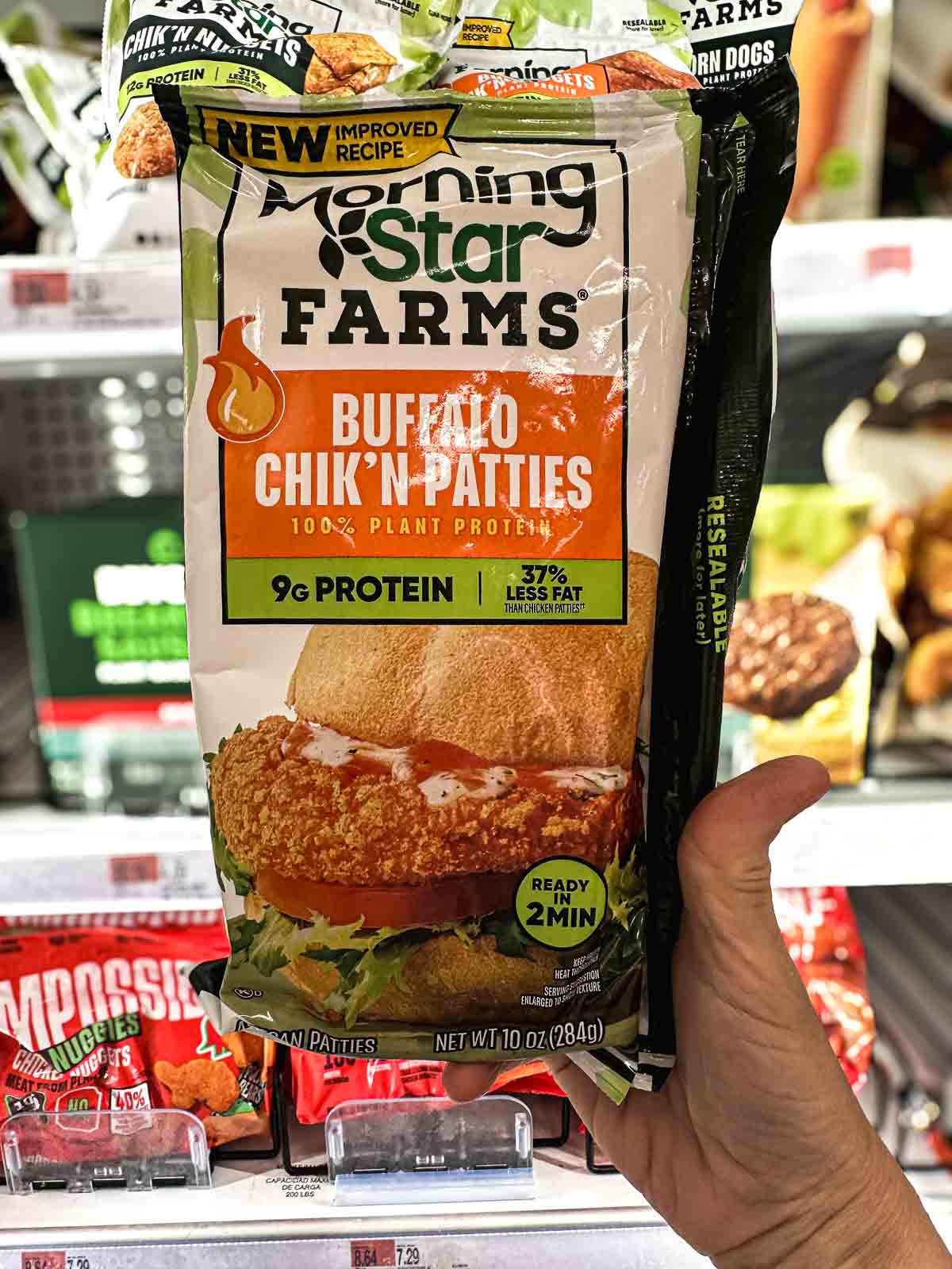 MorningStar Farms Buffalo Chik’n Patties – vegan frozen chicken patties made with 100% plant protein, held in grocery freezer aisle.