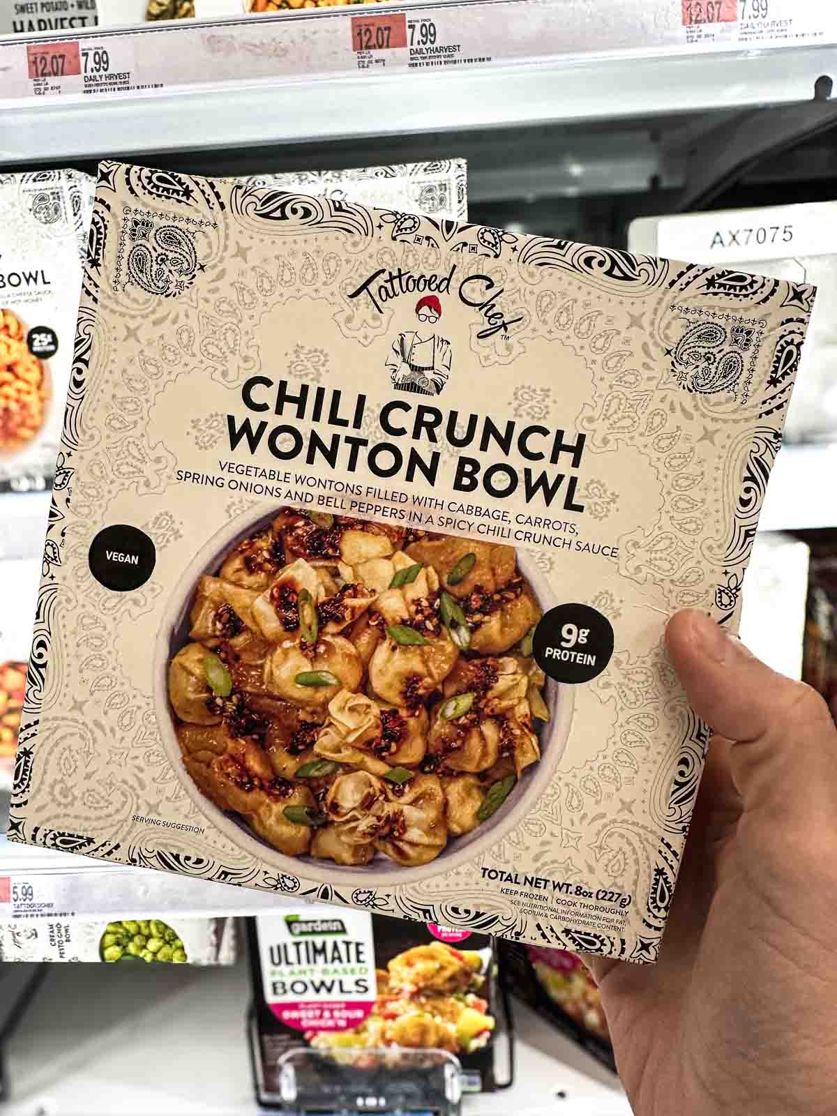 A package of vegan frozen wonton bowl by Tattooed Chef with chili crunch sauce.