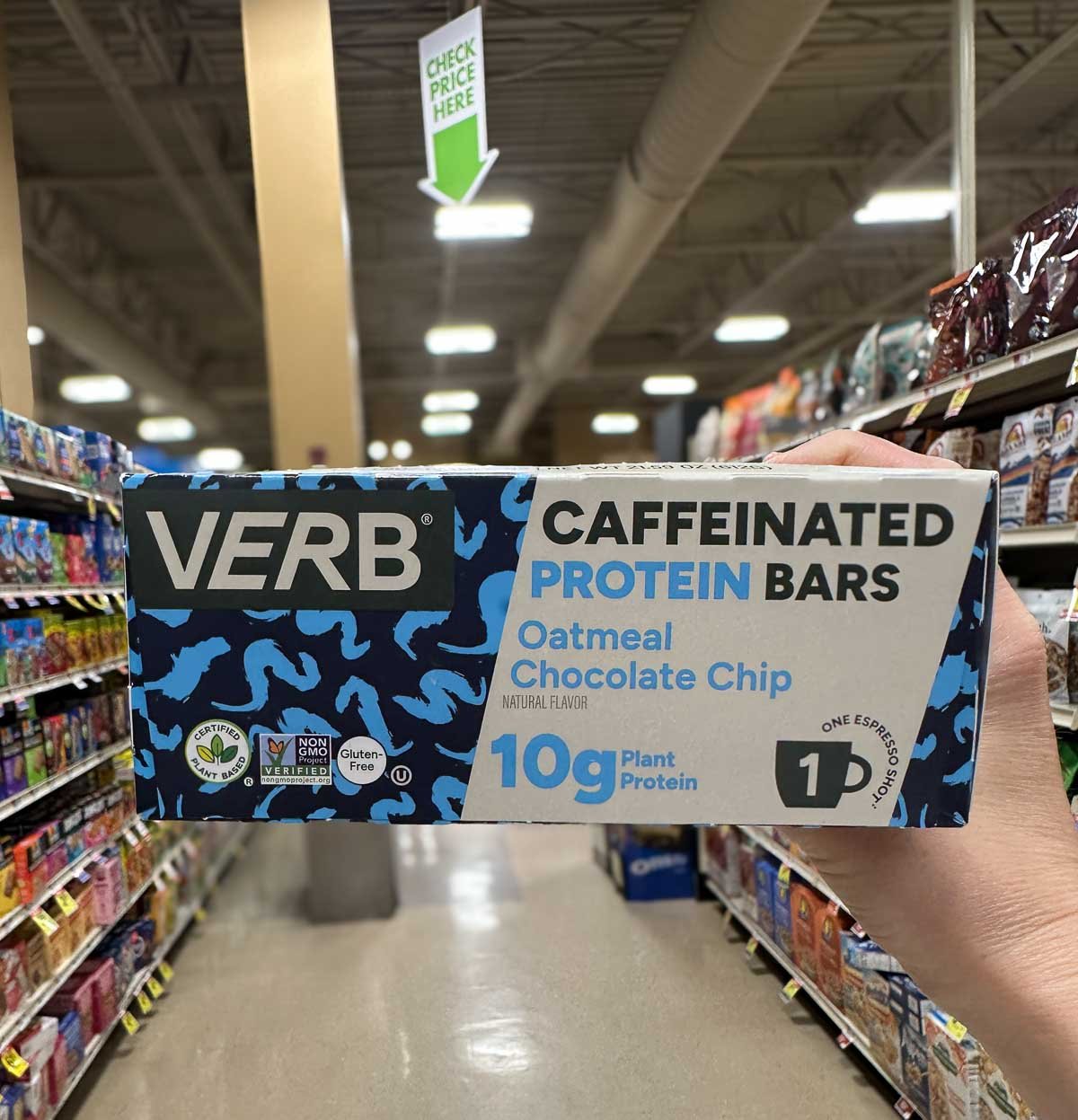 VERB oatmeal chocolate chip caffeinated protein bars with bold blue packaging, shot in a grocery store.