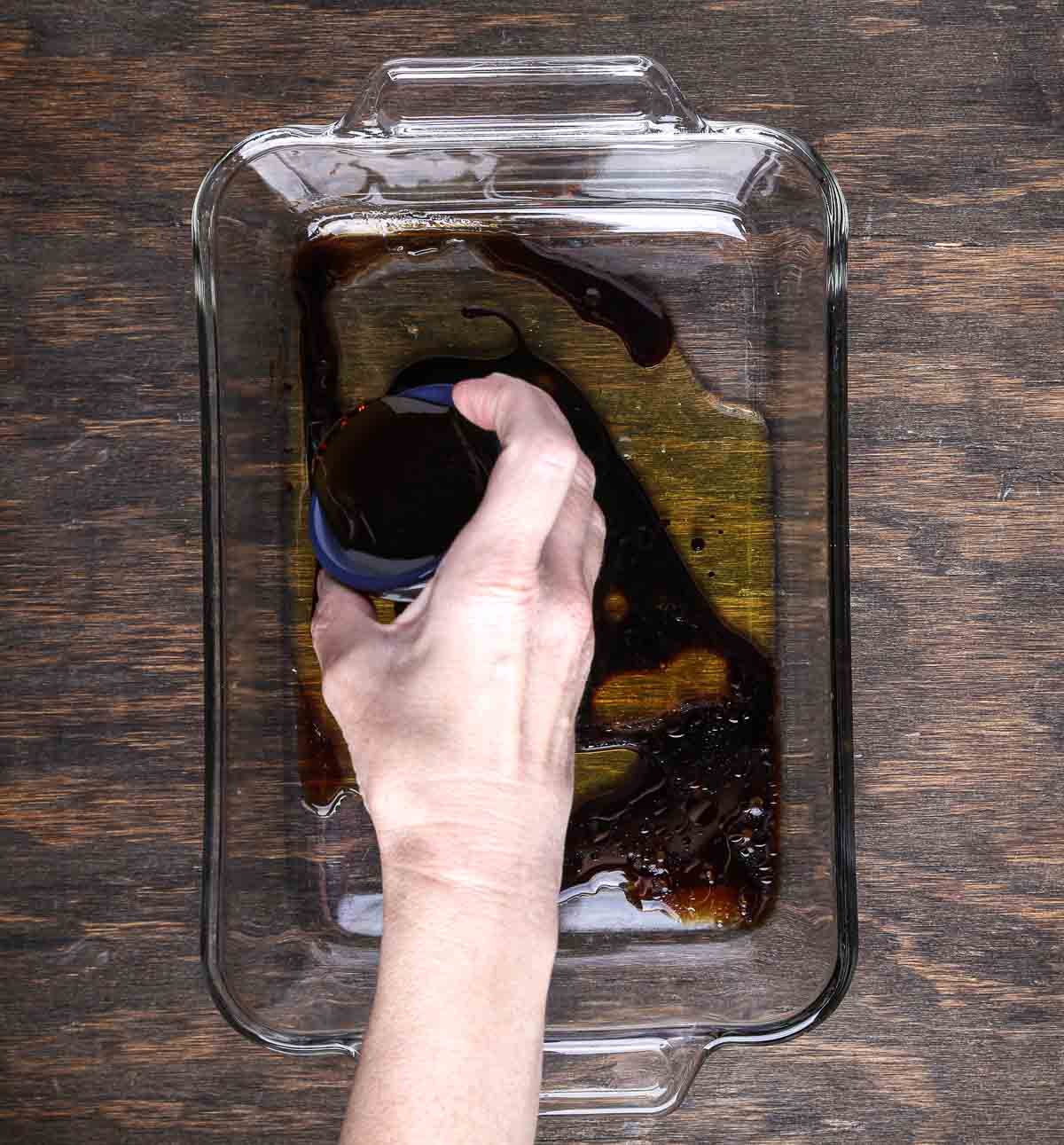 Combining tamari, maple syrup, and liquid smoke to create a marinade for tempeh bacon.