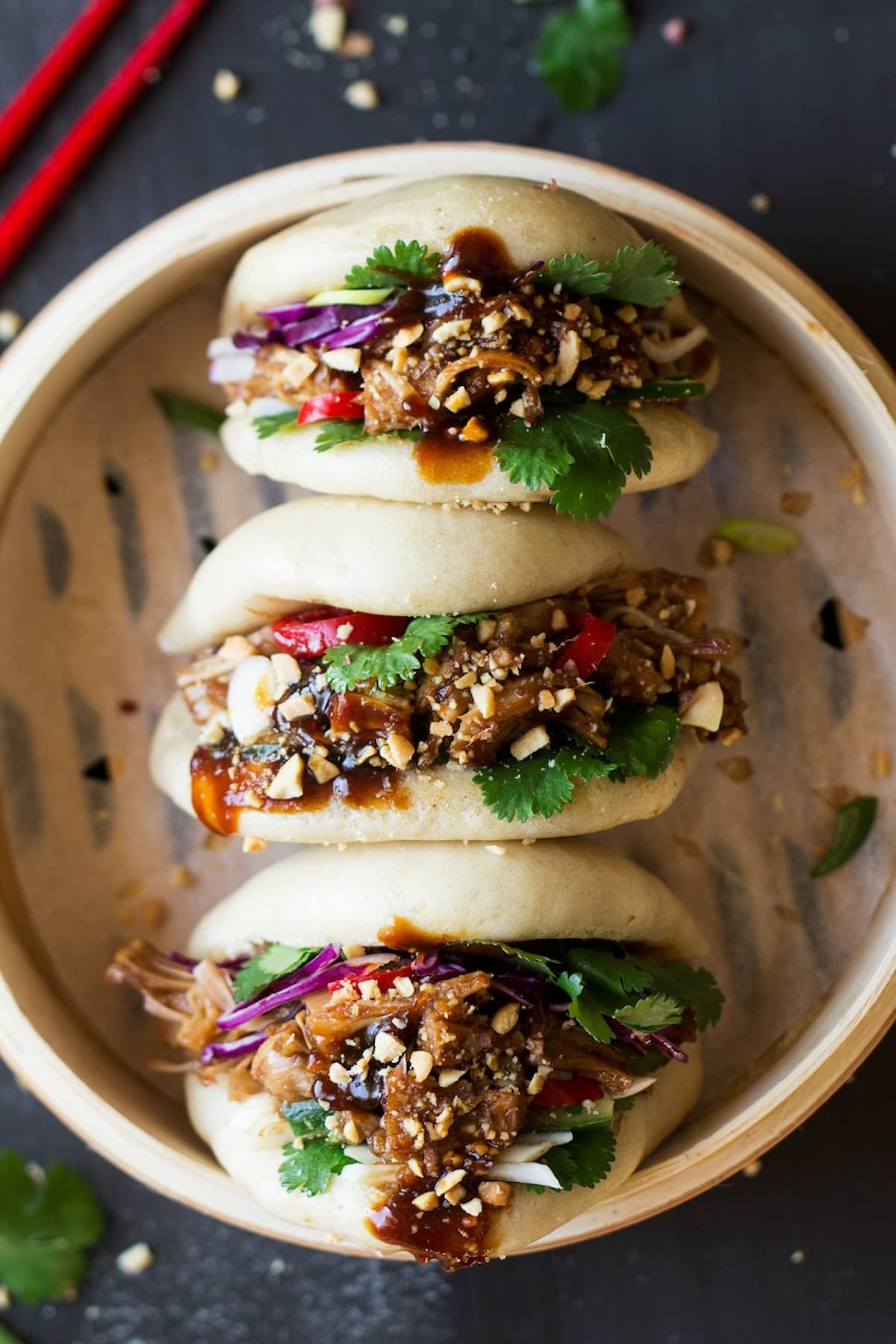 Steamed jackfruit bao buns filled with hoisin-glazed jackfruit, peanuts, cilantro, and shredded vegetables.