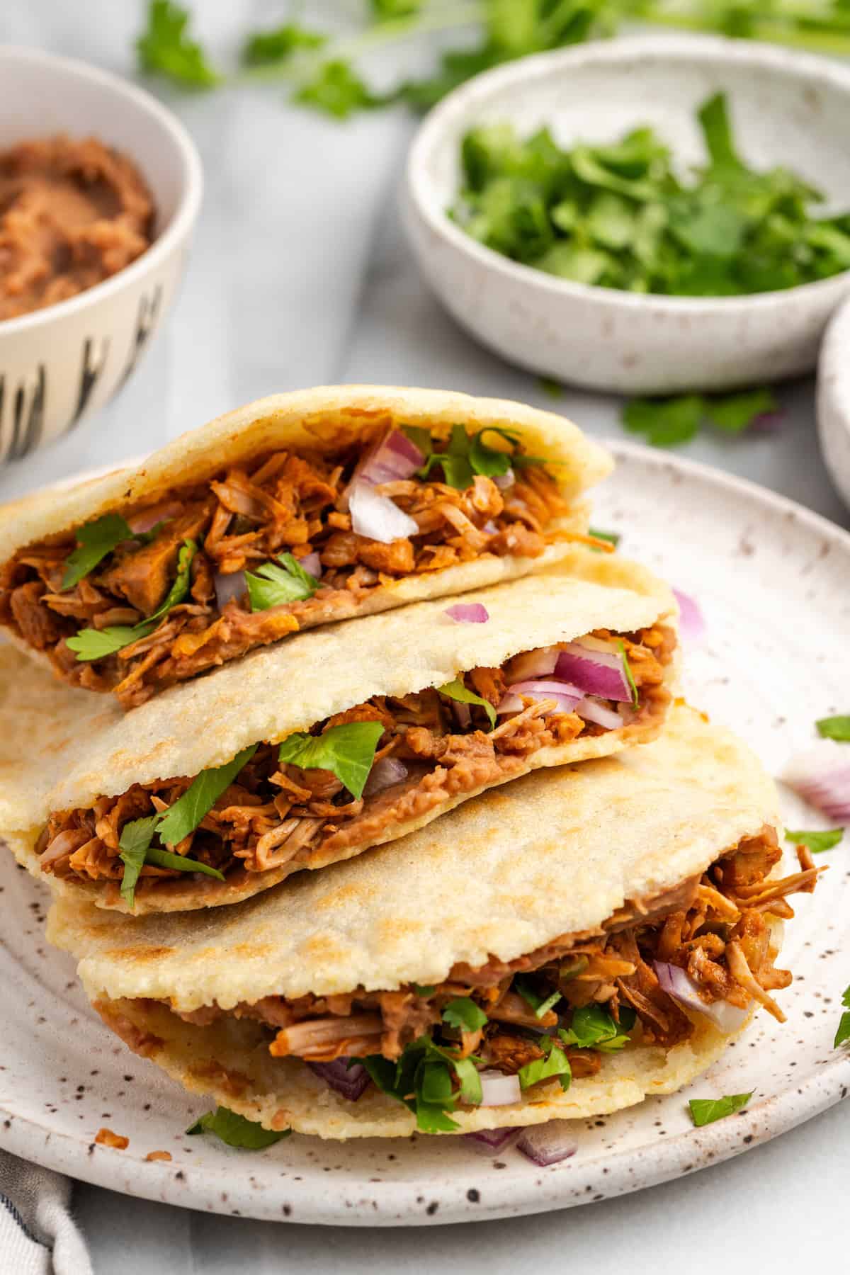 Warm homemade jackfruit gorditas stuffed with smoky shredded jackfruit, onions, and fresh cilantro.